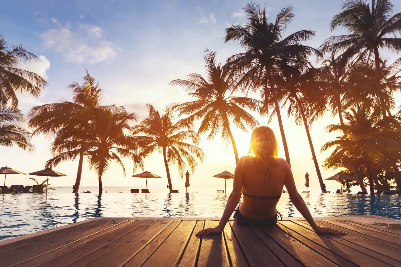 Vacation holidays at luxurious beachfront hotel resort with swimming pool Vacation holidays at luxurious beachfront hotel resort with swimming pool